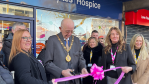 Mayor of Walsall cutting ribbon to open the Brownhills shop