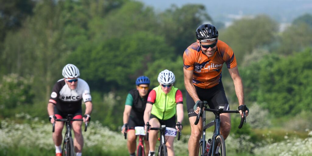 Supporters cycling in Cycle St Giles