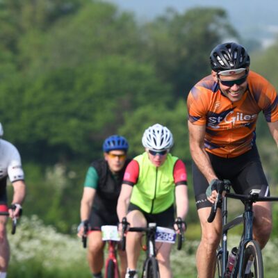 Supporters cycling in Cycle St Giles