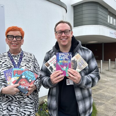 St Giles Hospice retail team preparing children’s books ahead of World Book Day celebrations.
