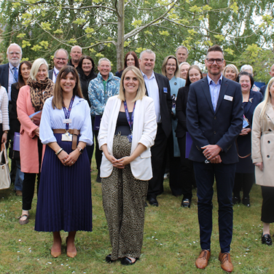 Group photograph of attendees at St Giles Hospice's Spring Celebration lunch, May 2026.