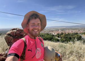James Lewis, a 26-year-old football coach from Rugeley, dribbling a football through rural Spain during his 2,000-mile fundraising challenge from Africa to England for St Giles Hospice.