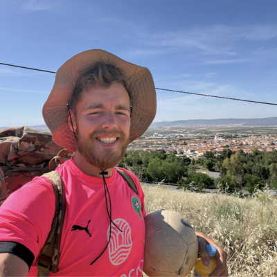 James Lewis, a 26-year-old football coach from Rugeley, dribbling a football through rural Spain during his 2,000-mile fundraising challenge from Africa to England for St Giles Hospice.