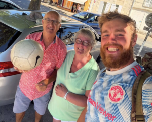 James Lewis, a 26-year-old football coach from Rugeley, pictured with French couple Tricia Sevellec and Jean-Pierre, who opened their home to him during his 2,000-mile fundraising challenge for St Giles Hospice.
