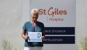 Jane Morris, Senior Family and Community Support Worker at St Giles Hospice, holding her highly commended award at the Palliative and End of Life Care Awards 2026.