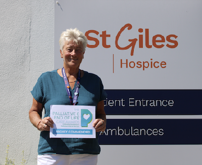 Jane Morris, Senior Family and Community Support Worker at St Giles Hospice, holding her highly commended award at the Palliative and End of Life Care Awards 2026.